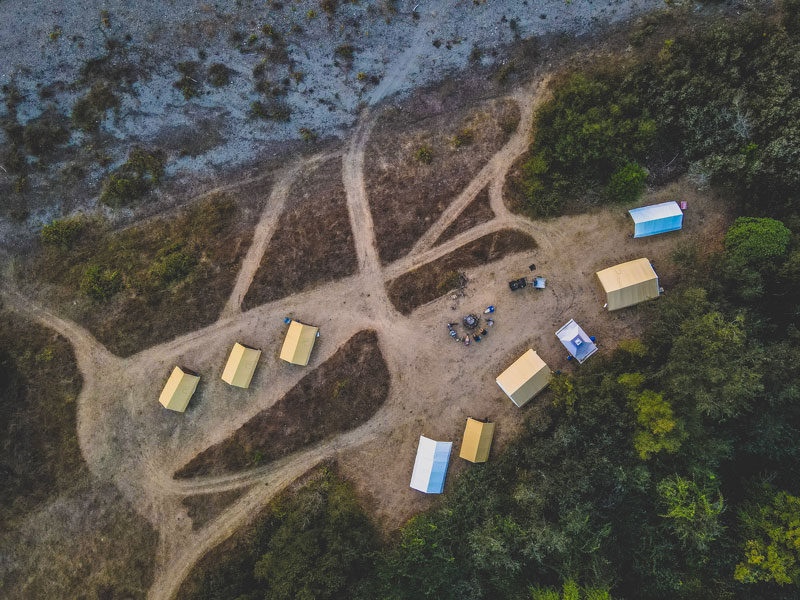 View of camp with four two-person guest tents